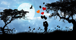 romantic picture with kissing silhouettes of two people with long hair